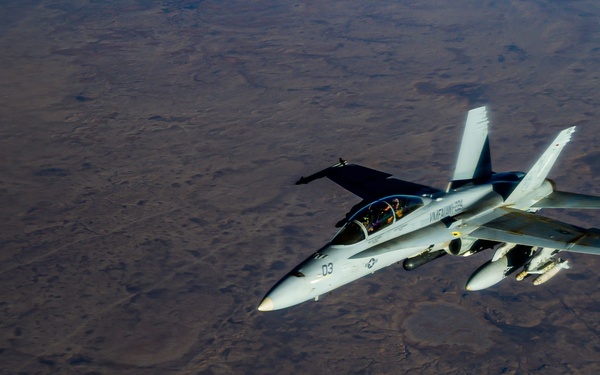 KC-135 Stratotanker Refuels F/A-18 Hornets