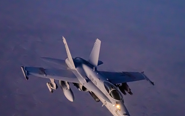 KC-135 Stratotanker Refuels F/A-18 Hornets