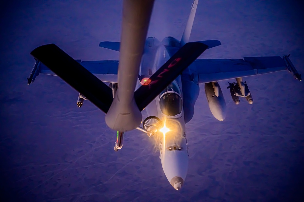 KC-135 Stratotanker Refuels F/A-18 Hornets