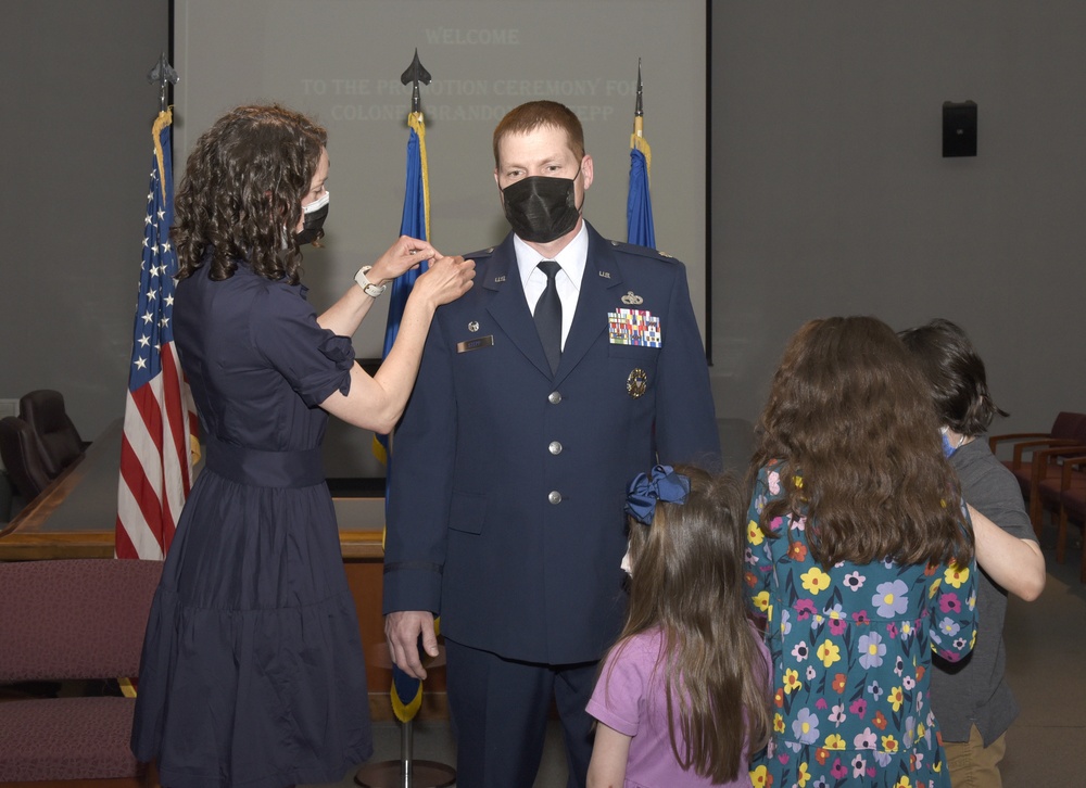 439th MSG commander pins on colonel