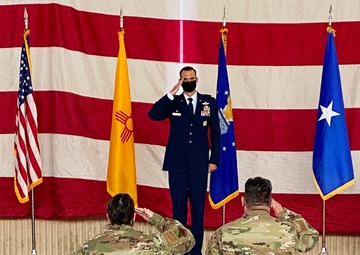 Colonel George Sefzik receives his first salute as the commander of the 150th Special Operations Wing