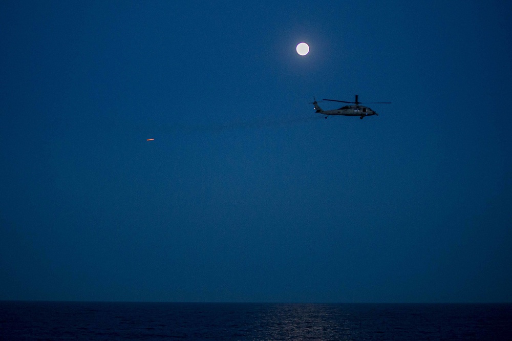 n MH-60 Sea Hawk helicopter fires on a target during a live fire exercise during Exercise Steadfast Defender 2021