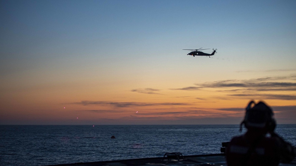 An MH-60 Sea Hawk helicopter fires on a target during a live fire exercise