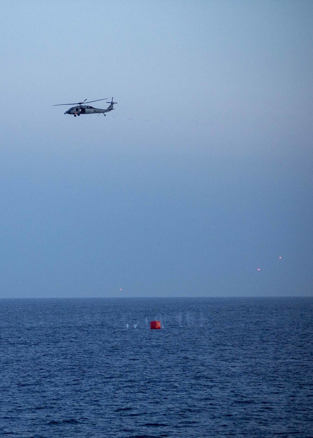 An MH-60 Sea Hawk helicopter fires on a target during a live fire exercise