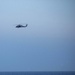 An MH-60 Sea Hawk helicopter fires on a target during a live fire exercise