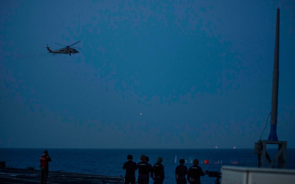 An MH-60 Sea Hawk helicopter fires on a target during a live fire exercise