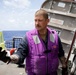 USS Sioux City Sailor Inspects a Fuel Sample on the Flight Deck