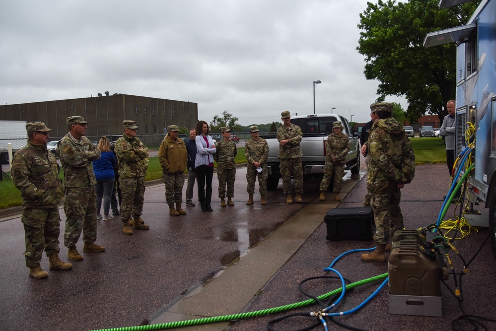 Members of the 114th Force Support Squadron and Babington Technology demonstrate Disaster Relief Mobile Kitchen Trailer (DRMKT) capabilities