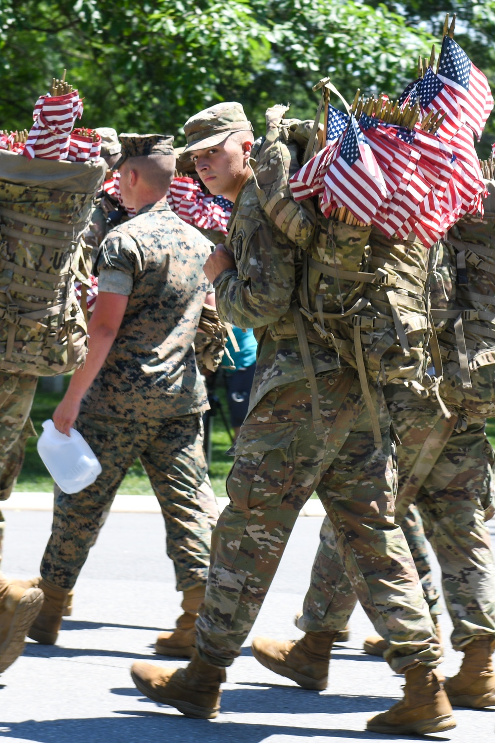 Service members place flags at Arlington National Cemetery