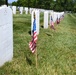 Service members place flags at Arlington National Cemetery