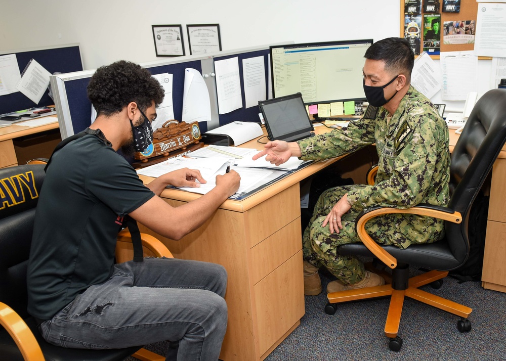NC1 Marvin Tan Screens a Navy Applicant