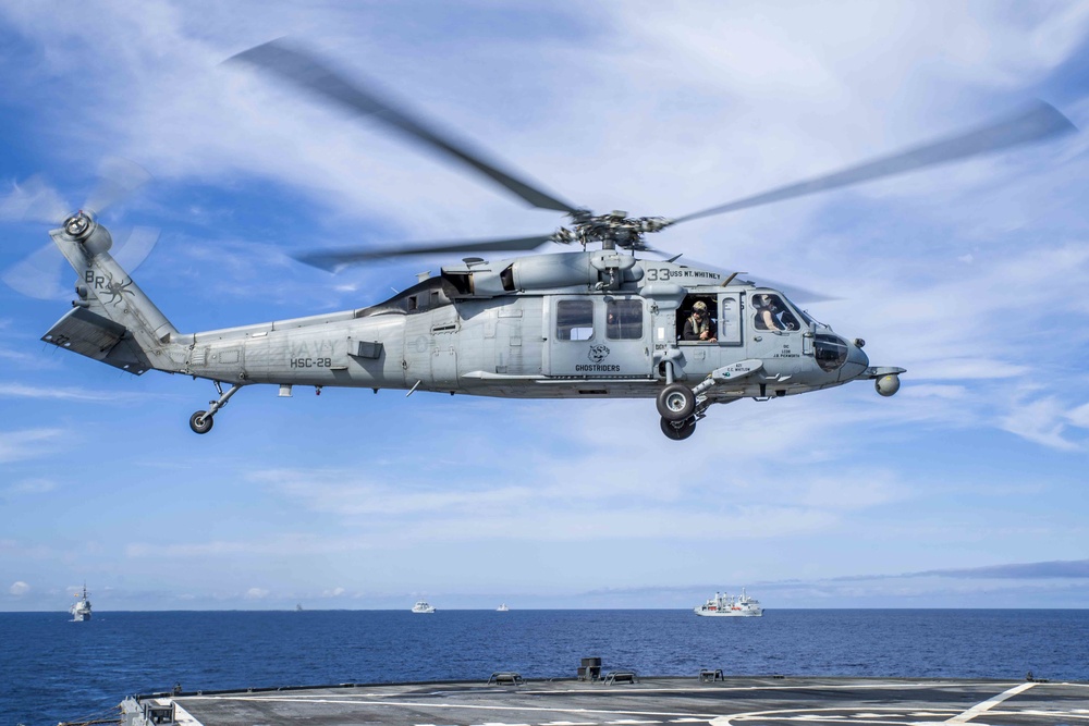 An MH-60 Sea Hawk helicopter  takes off from the Blue Ridge-class command and control ship USS Mount Whitney during Steadfast Defender 2021