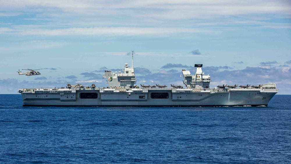 The HMS Queen Elizabeth sails in formation with the Blue Ridge-class command and control ship USS Mount Whitney during Exercise Steadfast Defender 2021