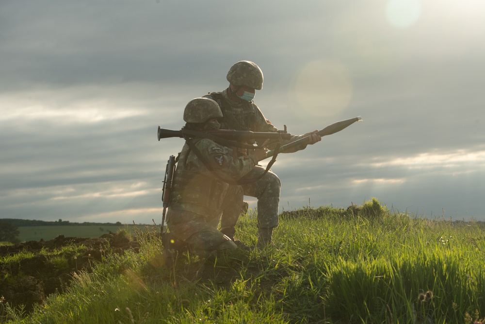 Romanian Soldier from 30th Mountain Scouts Battalion holds her position and aims her RPG-7 while conducting RPG LFX during Exercise Steadfast Defender 2021