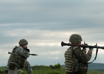 Romanian Soldier from 30th Mountain Scouts Battalion holds her position and aims her RPG-7 while conducting RPG LFX during Exercise Steadfast Defender 2021