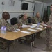 U.S. Army Command Sergeants Major with Task Force Avalanche, 130th Field Artillery Brigade, and Task Force Hellhound discuss scoring for board event during the TF Spartan Best Warrior Competition