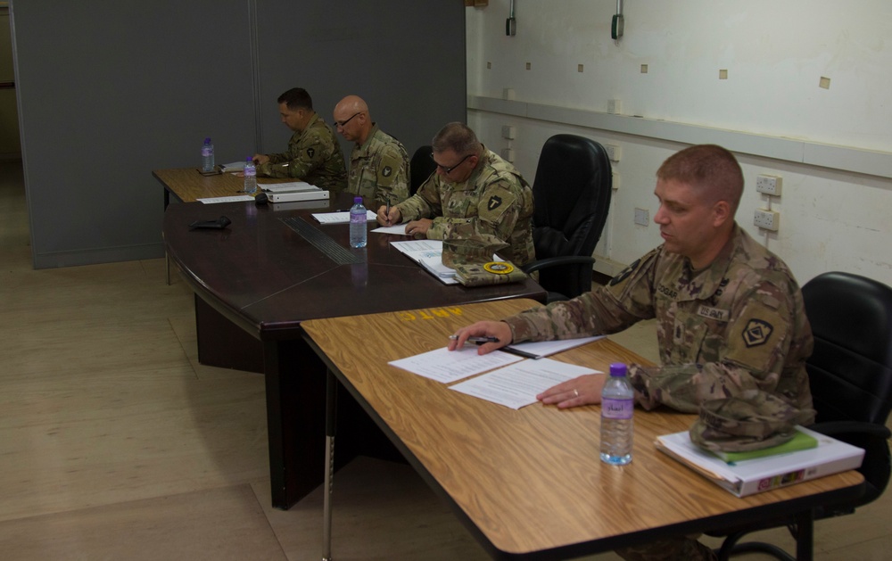 Task Force Spartan Best Warrior Competition 2021, command sergeants majors evaluate Soldiers during board event