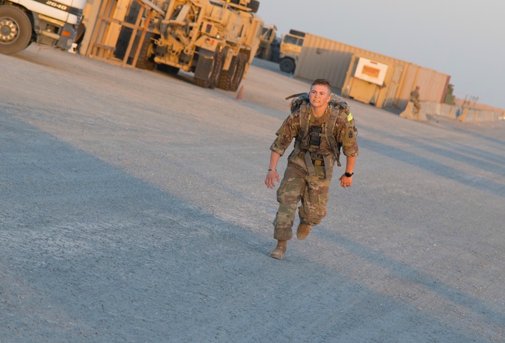 Task Force Avalanche Soldier sprints toward finish line of 12-mile ruck march, TF Spartan BWC 2021