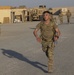 U.S. Army Spc. Destin Torres, Task Force Hellhound, runs to finish line of 12-Mile Ruck March portion of the TF Spartan Best Warrior Competition