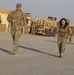 U.S. Army Sgt. Kaylamarie Hemm, Task Force Hellhound, steps toward finish line of 12-Mile Ruck March of TF Spartan Best Warrior Competition