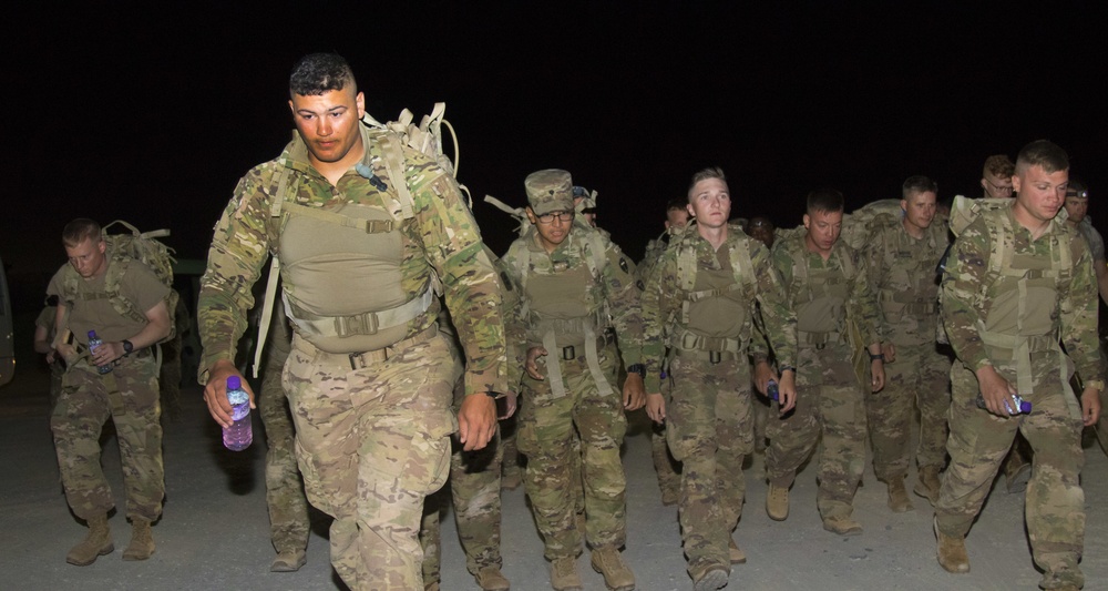 Task Force Spartan Soldiers step off for 12-mile ruck march of TF Spartan Best Warrior Competition 2021