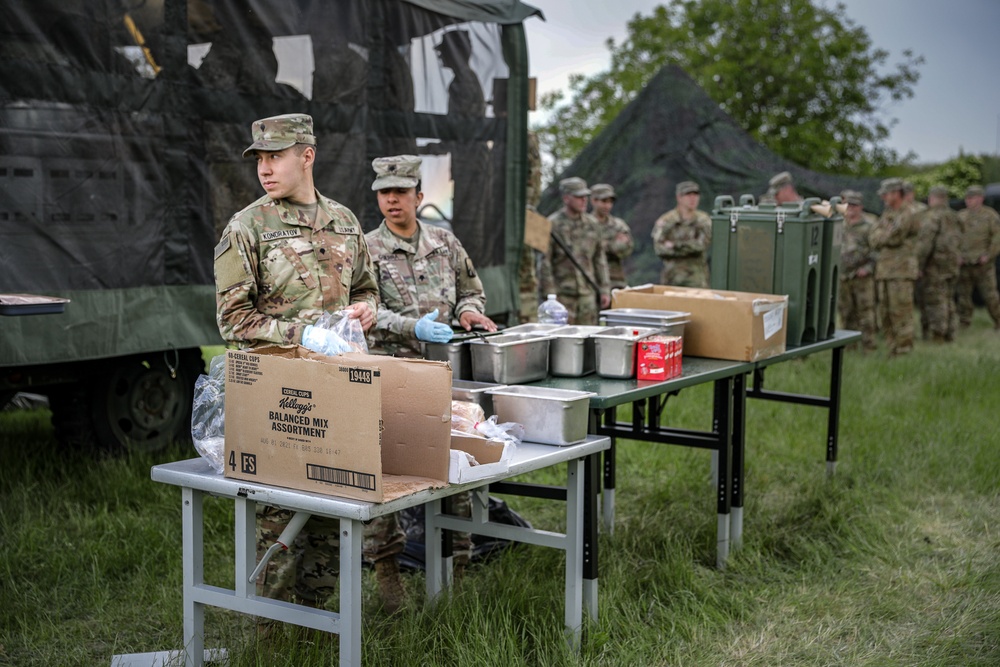 The 1-3rd Attack Battalion enjoys hot chow during DEFENDER-Europe 21