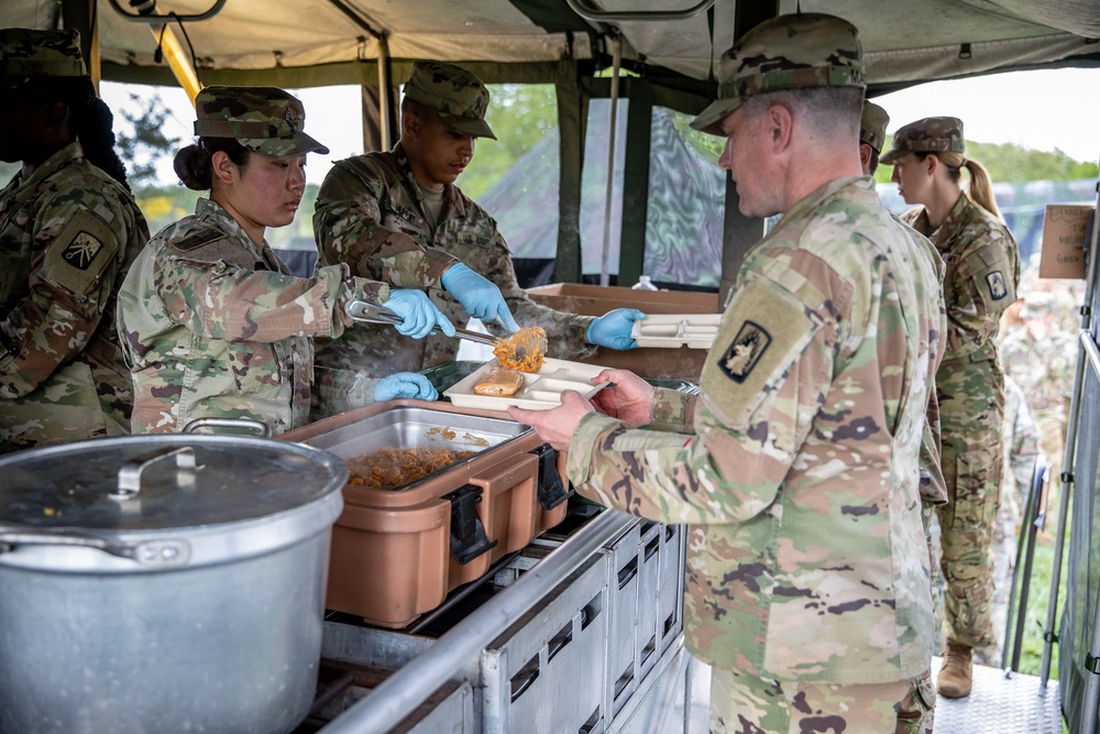 The 1-3rd Attack Battalion enjoys hot chow during DEFENDER-Europe 21