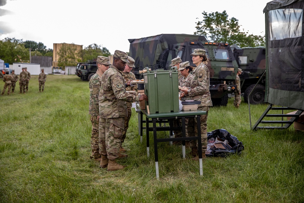 The 1-3rd Attack Battalion enjoys hot chow during DEFENDER-Europe 21