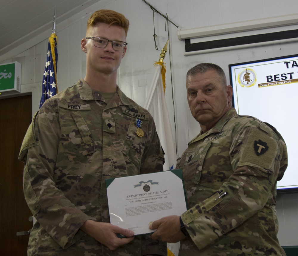 U.S. Army Spc. Peter Frey, Task Force Hellhound, accepts award as junior enlisted runner-up in the TF Spartan Best Warrior Competition 2021