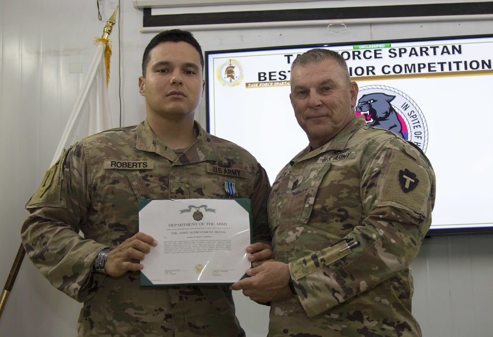 U.S. Army Sgt. Brent Roberts, Task Force Avalanche, accepts award as non-commissioned officer runner-up in the TF Spartan Best Warrior Competition