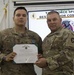 U.S. Army Sgt. Brent Roberts, Task Force Avalanche, accepts award as non-commissioned officer runner-up in the TF Spartan Best Warrior Competition