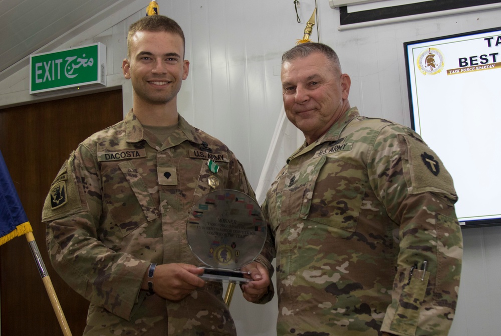 U.S. Army Spc. Omar Dacosta, Task Force Avalanche, accepts award for 1st place as top junior enlisted Soldier in TF Spartan Best Warrior Competition 2021