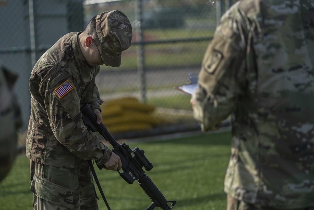 USARPAC BWC 2021: South Korea, Spc. Uriel Trejo, a 94th Army Air and Missile Defense Command soldier, conducts a weapons check on an M4 carbine