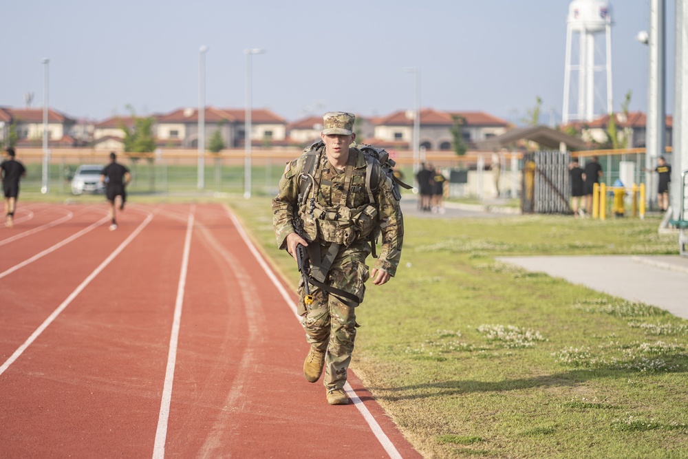 USARPAC BWC 2021: South Korea, Pfc. Kyle Kingman, a 311th Theater Tactical Signal Brigade soldier, competes in a 13 mile foot march