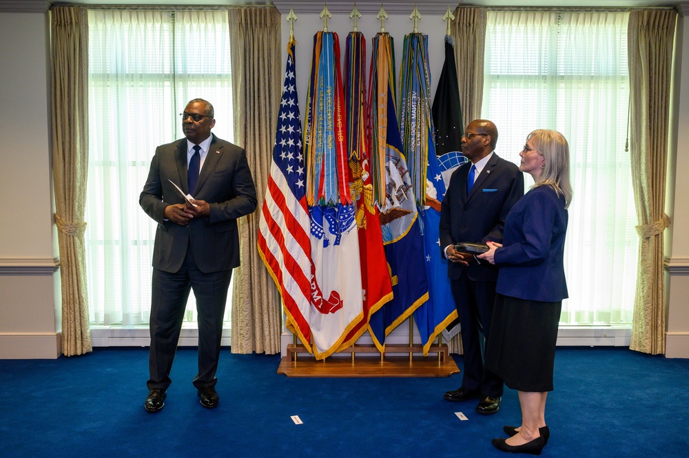 Secretary of Defense Lloyd J. Austin III swears in Under Secretary of Defense for Intelligence and Security Ronald Moultrie