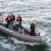 USS Gabrielle Giffords (LCS 10) Sailors transport personnel to shore