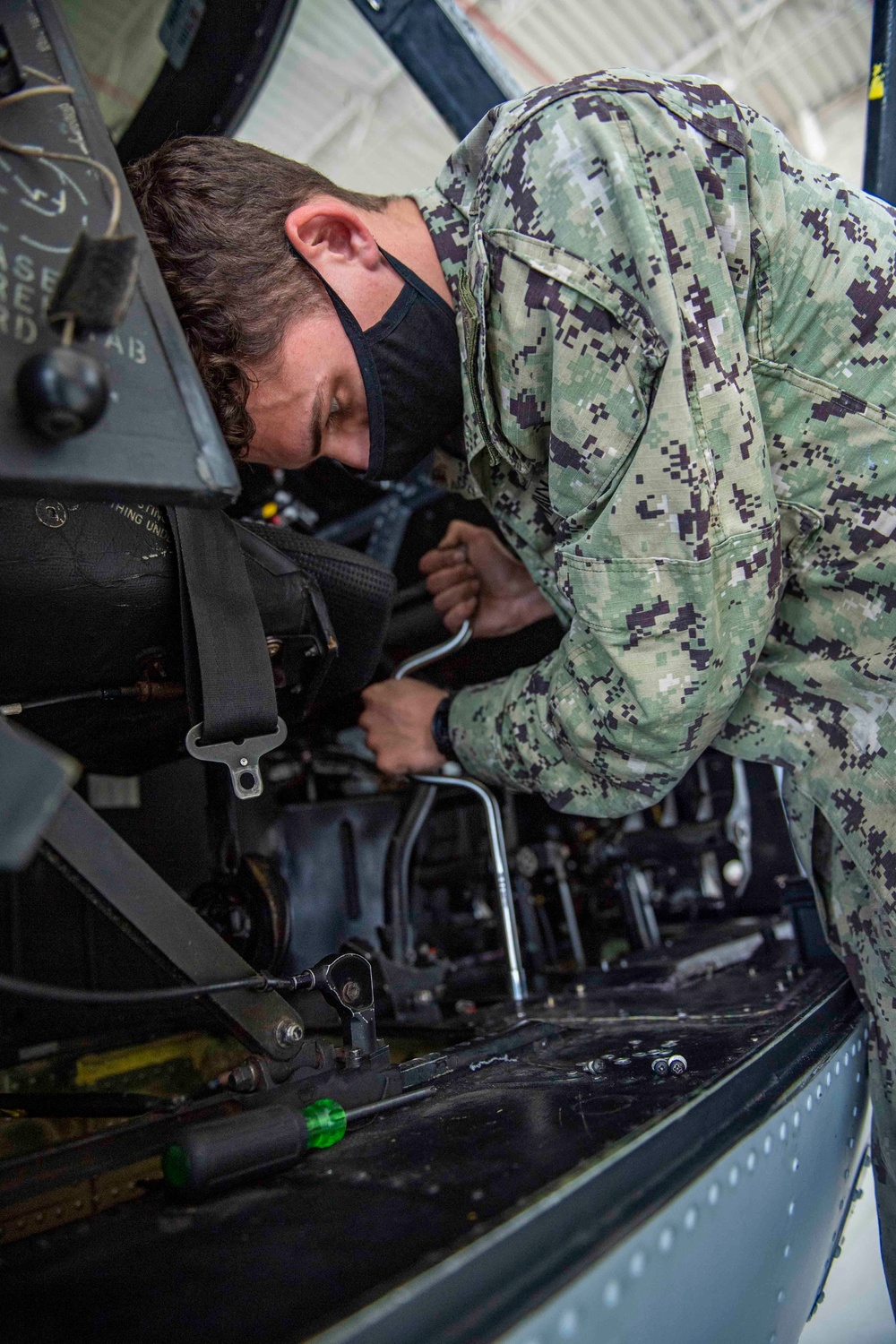 HSC-85 Maintainer Reassembles MH-60S Knighthawk Cockpit