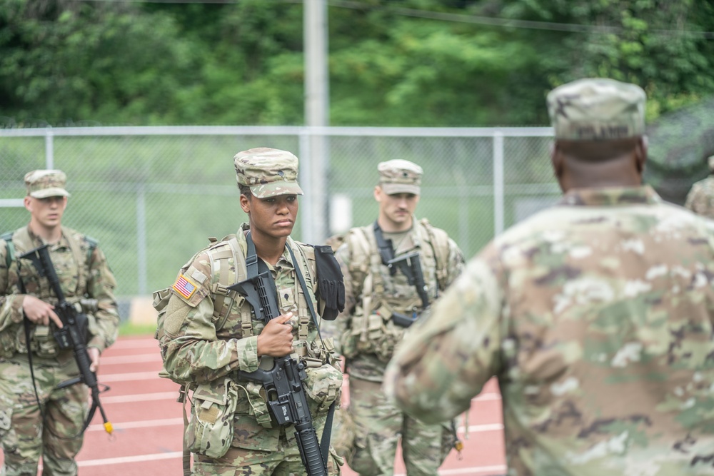 USARPAC BWC 2021: South Korea, Pfc. Kyle Kingman, Spc. Brooke Henricks, and Spc. Seth Piotti gets briefed on the Warrior Tasks and Battle Drills lane