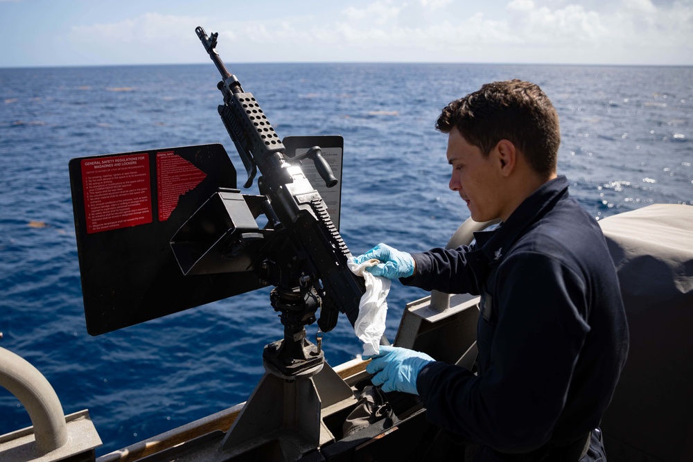 USS Sioux City Sailor Conducts Maintenance on M240B Machine Gun