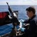 USS Sioux City Sailor Conducts Maintenance on M240B Machine Gun