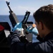 USS Sioux City Sailor Conducts Maintenance on M240B Machine Gun