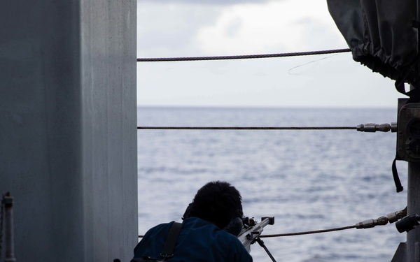 USS Sioux City Sailor Participates in a .50-Caliber Machine Gun Shoot