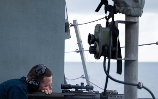 USS Sioux City Sailor Participates in a .50-Caliber Machine Gun Shoot