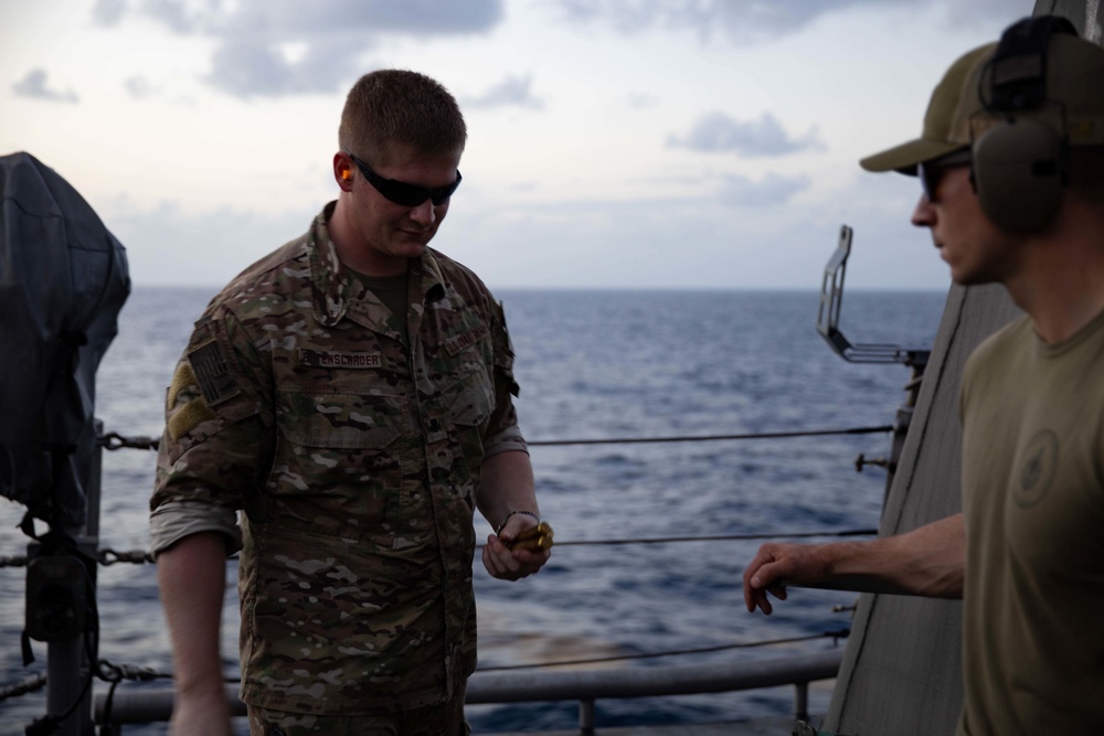 Coast Guardsmen and USS Sioux City Sailors Participate in a Gun Shoot