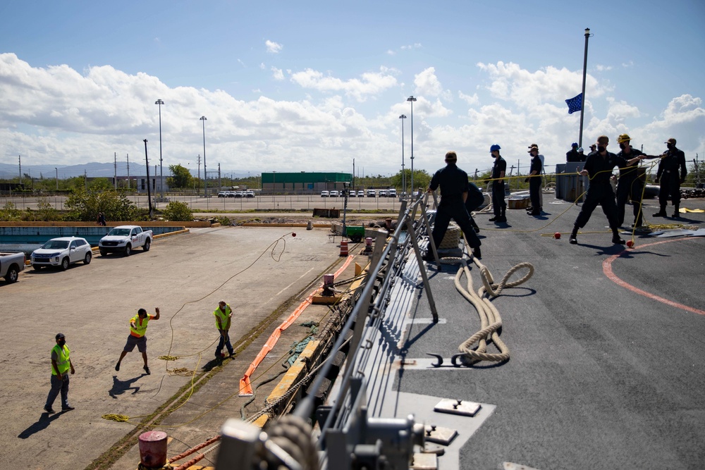 USS Sioux City Sailors Handle Lines While the Ship Pulls into Puerto Rico