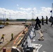 USS Sioux City Sailors Handle Lines While the Ship Pulls into Puerto Rico