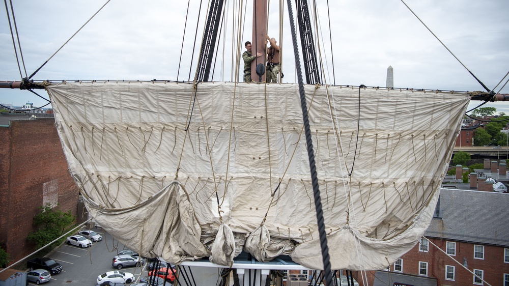 Sailors assigned to USS Constitution conduct sail maintenance on the ship’s Mizzen Topsail