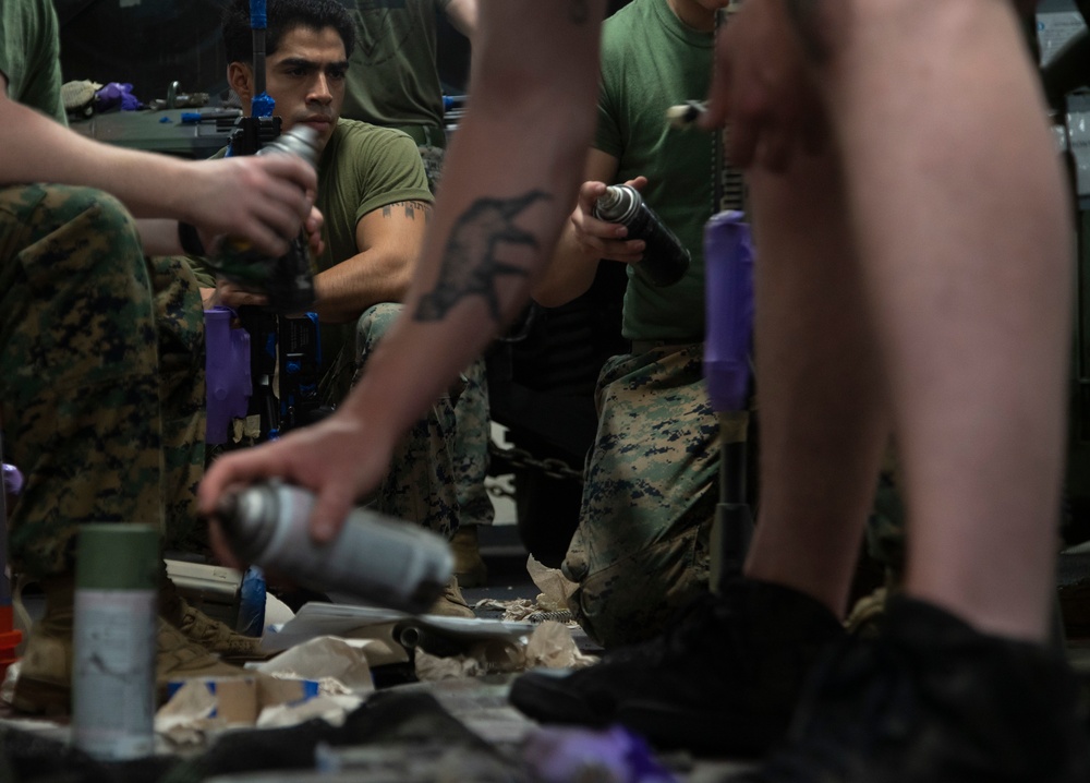 15th MEU Marines, Sailors camouflage rifles