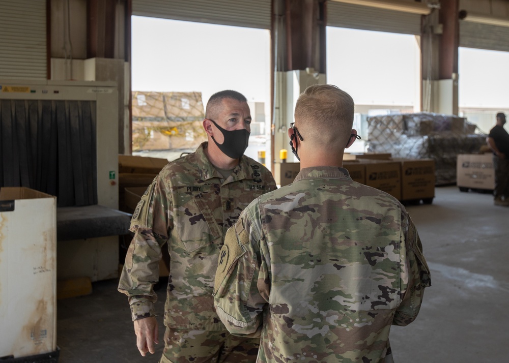 Command Sgt. Maj. Michael Perry visits Soldiers of the Joint Military Mail Terminal