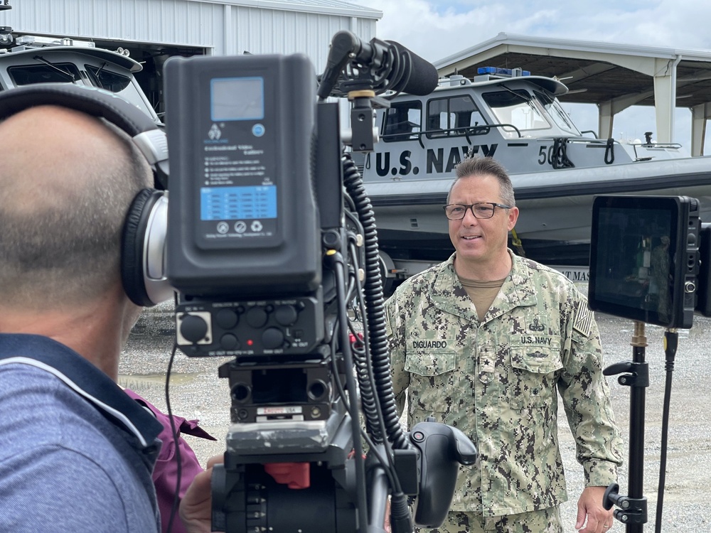 Commander Navy Expeditionary Combat Command, speaks to a camera crew about the importance of the Maritime Expeditionary Security Forces.